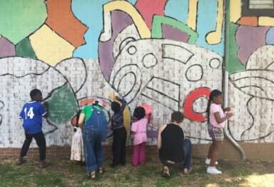 Elementary Students Design, Paint Mural with Local Artist